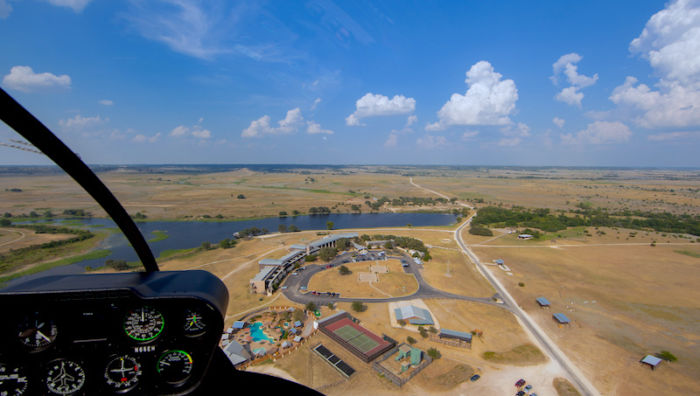 Helicopter landing at Rough Creek Lodge